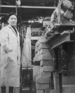 (Original Caption) Dr Chien-Shiung Wu, professor of Physics at Columbia University in New York, is shown at work with the apparatus used in experimental work that reportedly has conclusively proved a new and fundamental theory in nuclear physics---the theory of conservation of vector current. Cited as one of the world's foremost experimental physicists, Professor Wu and two associates tested the theory in a lengthy series of experiments. The theory deals with a type of subatomic behavior known as "weak interaction," one of nature's four basic kinds of physical interaction.
